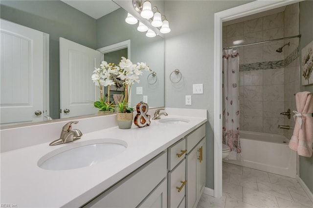 full bathroom with shower / tub combo with curtain, vanity, and toilet