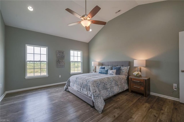 bedroom featuring dark wood-type flooring, high vaulted ceiling, and ceiling fan