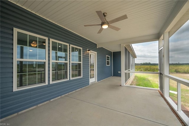 view of patio featuring ceiling fan