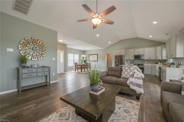 living room with ceiling fan, lofted ceiling, and dark hardwood / wood-style floors