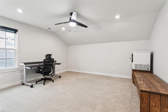 office space with recessed lighting, baseboards, vaulted ceiling, and light colored carpet