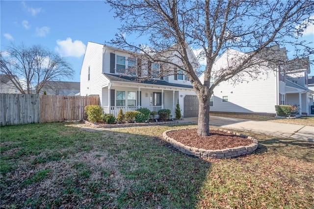 view of front of house with a porch, a garage, and a front yard