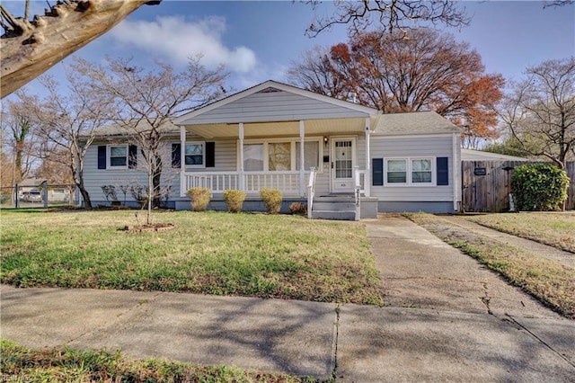 view of front of house with a front lawn and a porch