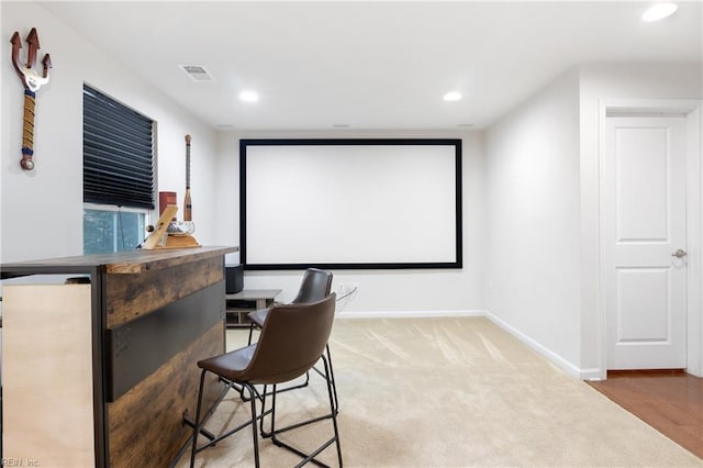 home theater room featuring carpet flooring