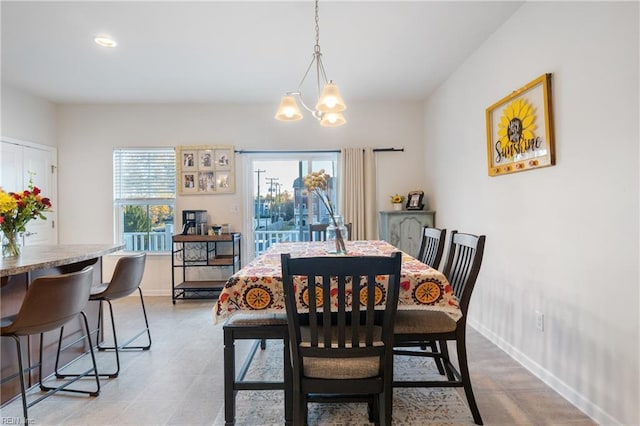 dining space featuring an inviting chandelier