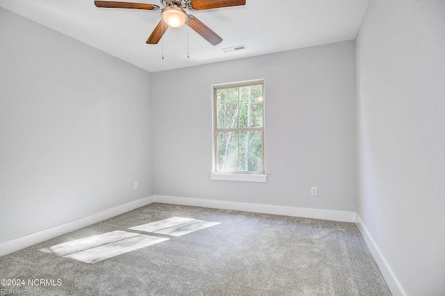 carpeted empty room with ceiling fan