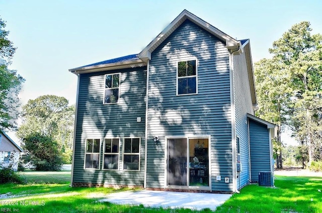 back of property featuring a patio, central air condition unit, and a lawn