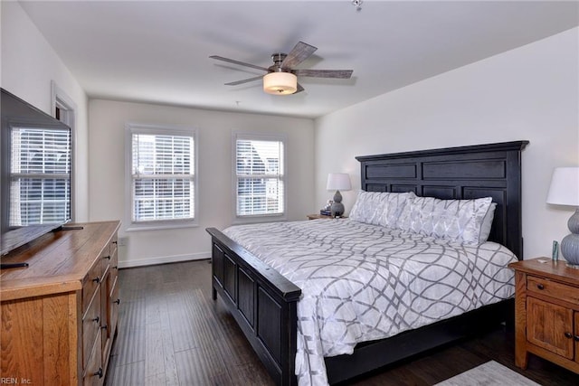 bedroom featuring ceiling fan and dark hardwood / wood-style flooring