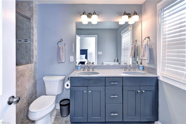 bathroom with vanity and toilet