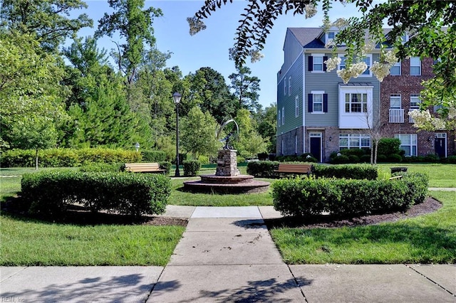 view of community featuring a lawn