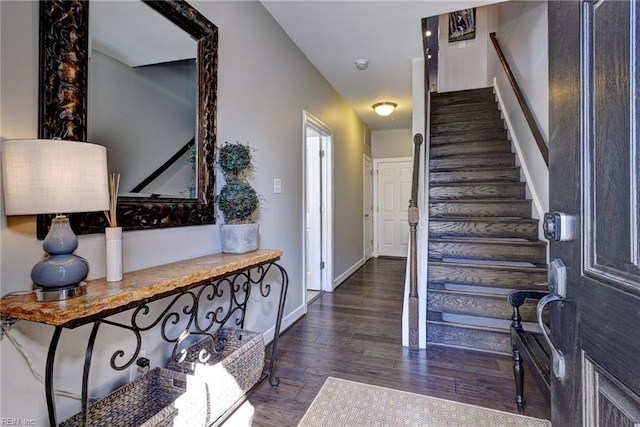 entryway with dark hardwood / wood-style flooring