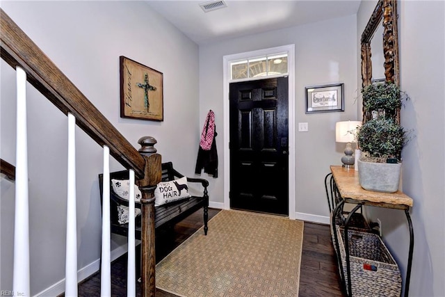 foyer entrance featuring dark hardwood / wood-style floors