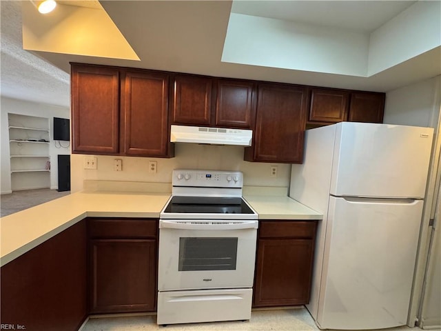 kitchen with white appliances and kitchen peninsula