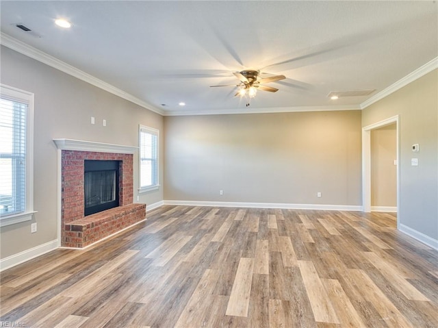 unfurnished living room with ornamental molding and light hardwood / wood-style floors