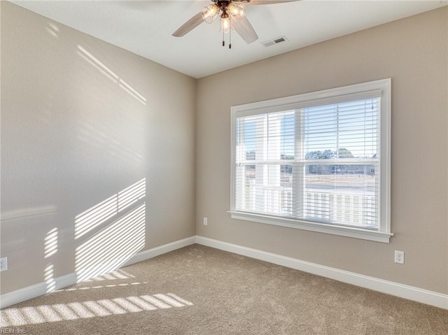 carpeted empty room with ceiling fan