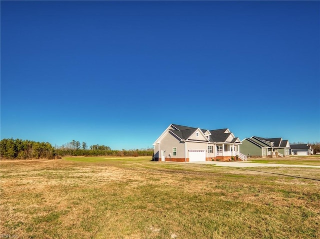 exterior space featuring a garage and a front yard