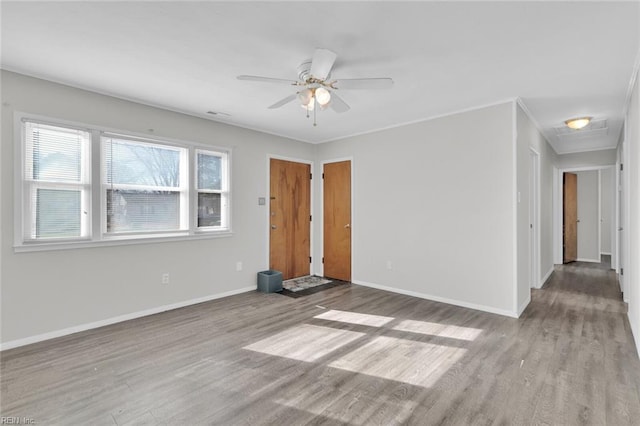 unfurnished room with ceiling fan and light wood-type flooring