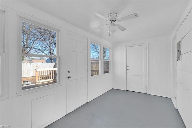 interior space featuring electric panel and ceiling fan