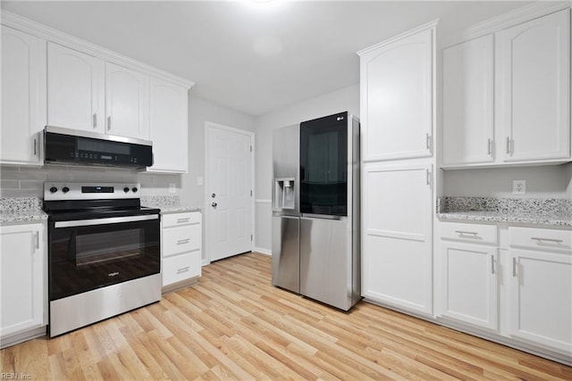 kitchen with stainless steel appliances, light stone countertops, light wood-type flooring, and white cabinets