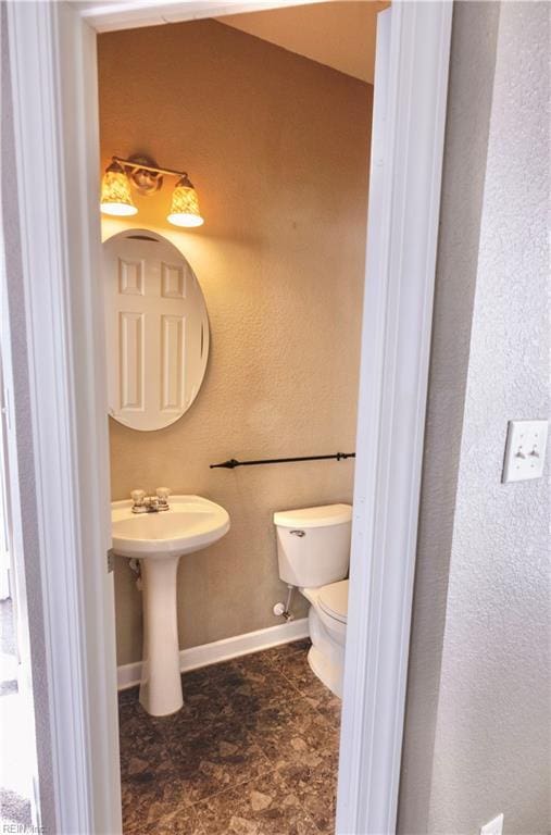 bathroom with sink and toilet