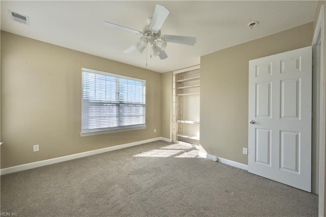 unfurnished bedroom with carpet floors and ceiling fan