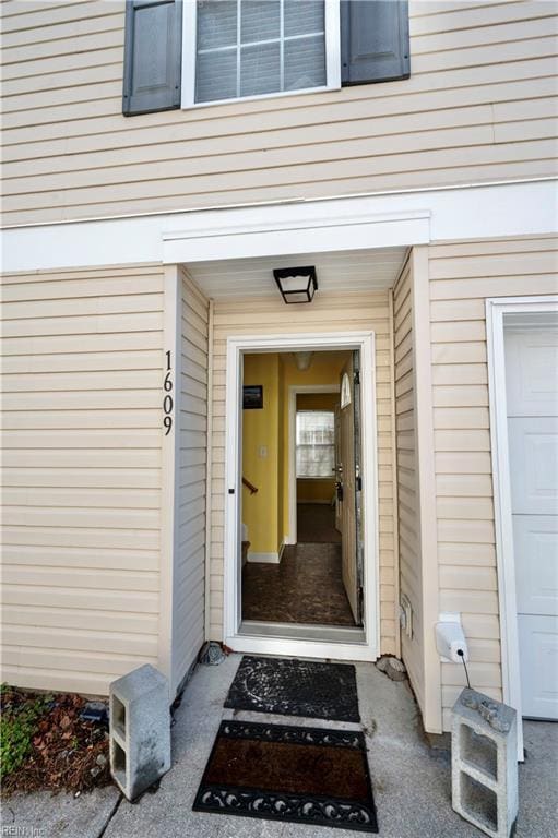 view of exterior entry featuring a garage