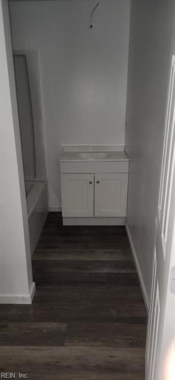 interior space featuring hardwood / wood-style floors and a bathtub