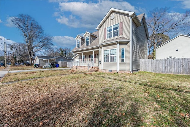 view of front of home featuring a front lawn and covered porch