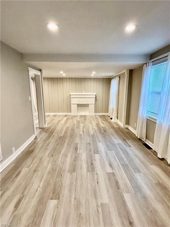 unfurnished living room with light hardwood / wood-style flooring