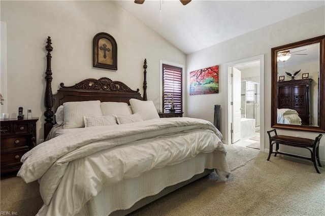 carpeted bedroom featuring lofted ceiling, connected bathroom, and ceiling fan