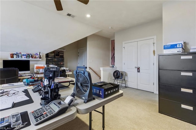 carpeted office featuring ceiling fan