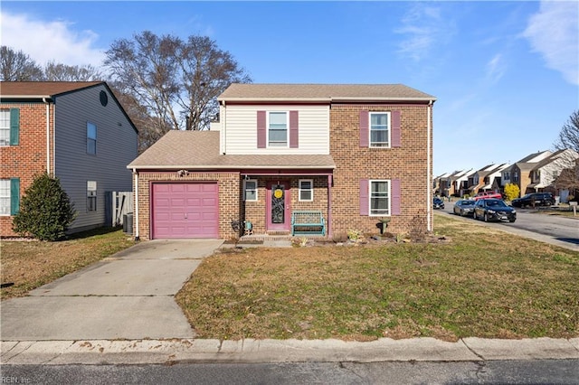 view of property featuring a garage and a front yard