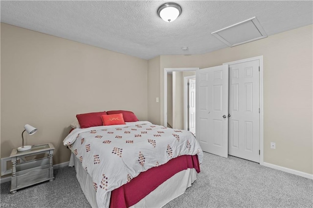 carpeted bedroom with a textured ceiling