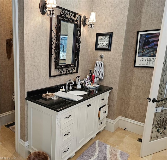 bathroom with tile patterned floors and vanity