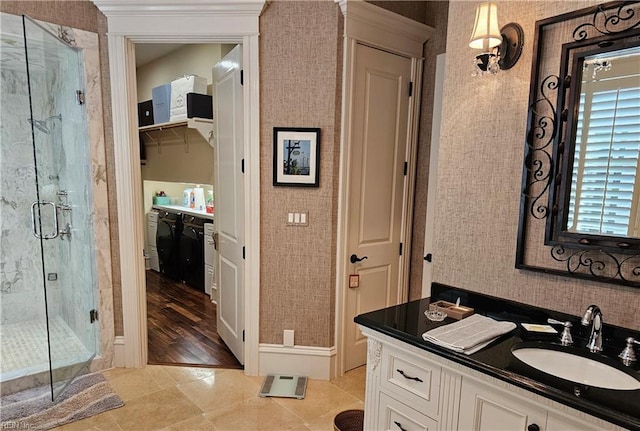 bathroom featuring an enclosed shower, vanity, and tile patterned flooring