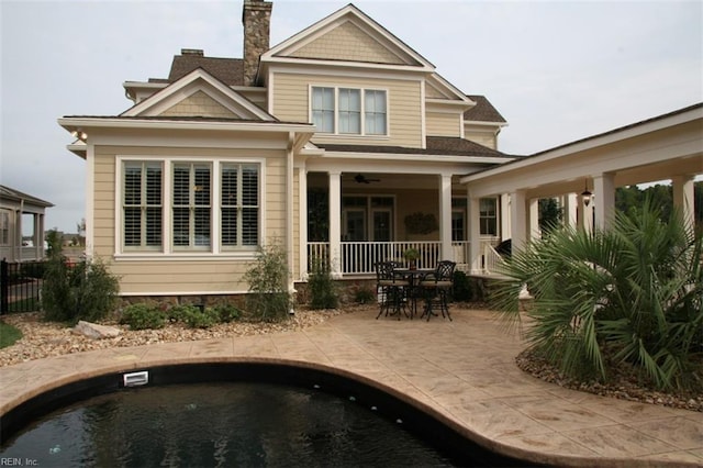 rear view of property featuring a patio