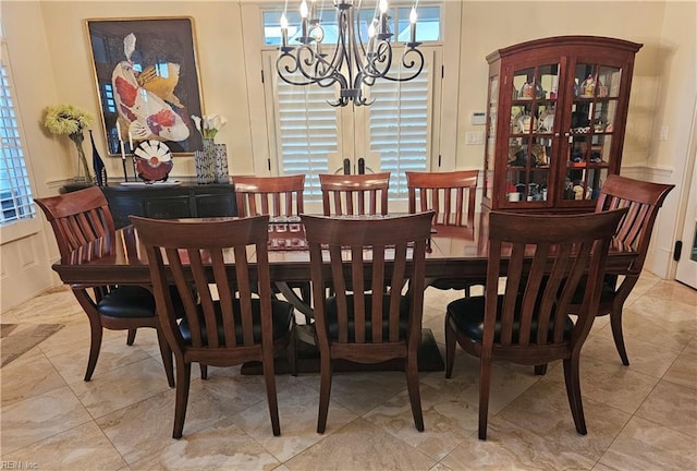 dining space with a notable chandelier