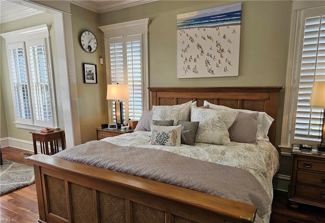 bedroom featuring ornamental molding and dark hardwood / wood-style flooring