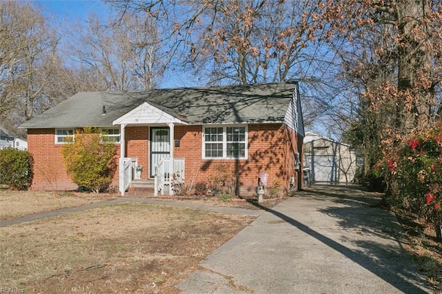 bungalow-style house featuring a garage and a front yard