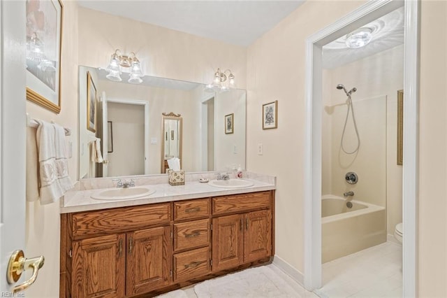 full bathroom featuring washtub / shower combination, vanity, toilet, and tile patterned flooring