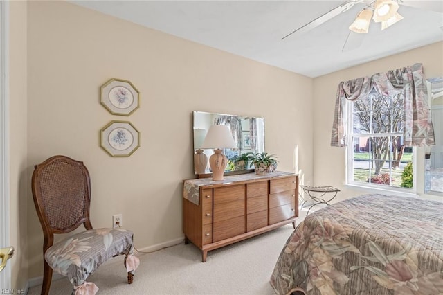 bedroom with light colored carpet and ceiling fan