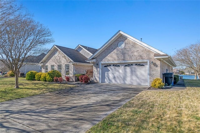 view of front of property with a garage and a front yard