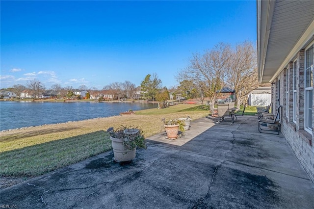 view of patio with a gazebo and a water view