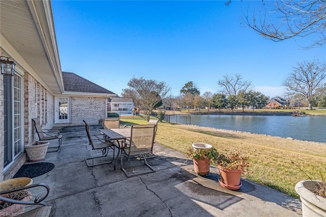 view of patio with a water view