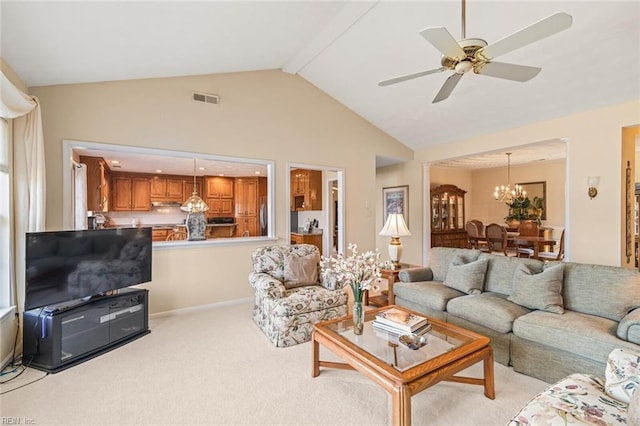 living room featuring light carpet, ceiling fan with notable chandelier, and vaulted ceiling