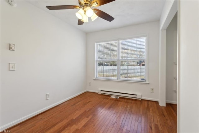 empty room with ceiling fan, a baseboard radiator, and wood-type flooring