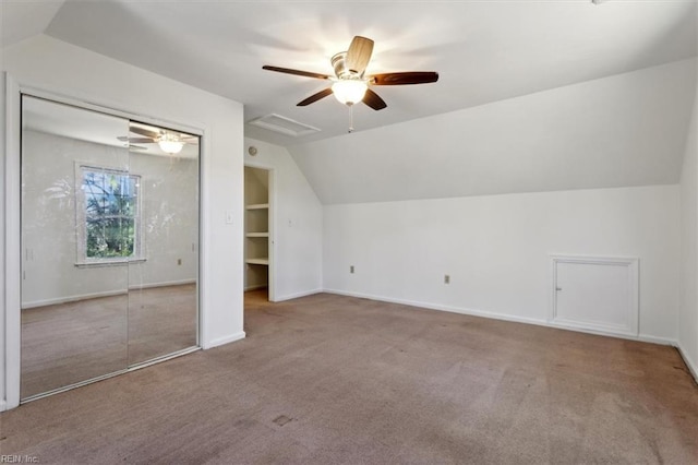 bonus room featuring vaulted ceiling, light carpet, and ceiling fan