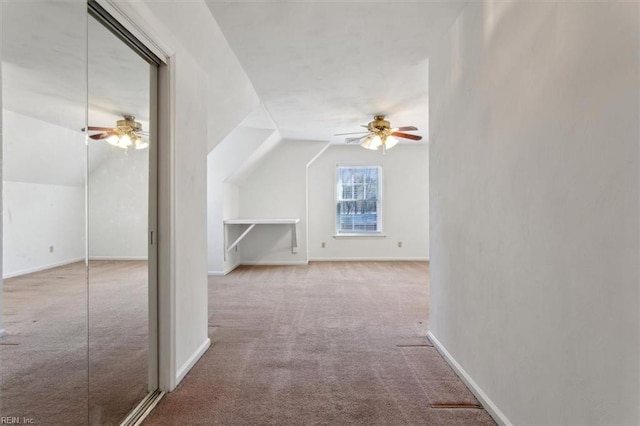 bonus room featuring lofted ceiling, light carpet, and ceiling fan