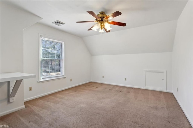 bonus room with lofted ceiling, light colored carpet, and ceiling fan