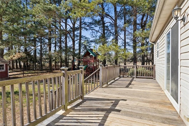 wooden terrace with a playground